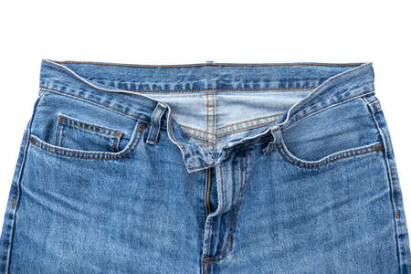 Top part of used blue jeans with zipper and pockets isolated on whiteの写真素材