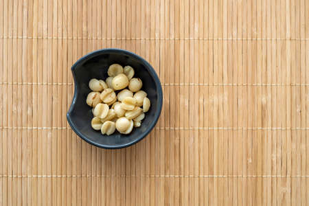 Sweet Lotus seeds on a small bowl. Canned Lotus beans as the traditional asian food, snack top viewの写真素材