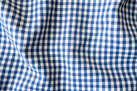 Wavy checkered blue fabric, tablecloth as texture or background, top viewの写真素材