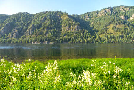 Amazing summer landscape in Siberia. Divnogorsk town with Yenisei river, blue sky, mountains in Russiaの写真素材