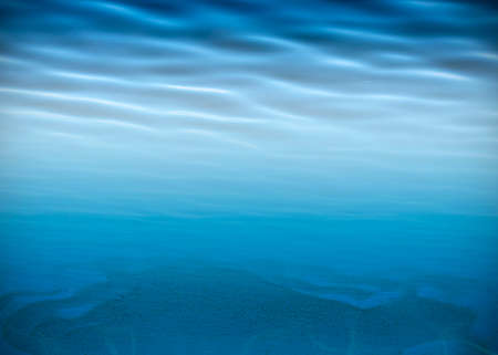 Underwater background, water surface, sandy bottom with space for textの写真素材