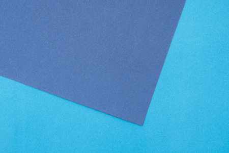 Dark blue and light blue, violet cardboard sheets as mockup, top view, space for textの写真素材