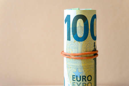 Close-up of twisted one hundred euro bills, 100 Euro bill, business concept pictureの写真素材