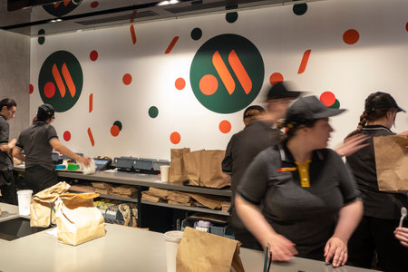 MOSCOW - JUNE 12: Interior with staff of new rebranding fast food chain The rebranded logo of Vkusno and tochka in Moscow, 12. 06. 2022 in Russia.のeditorial素材