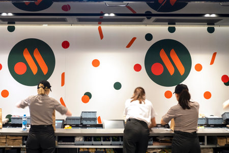 MOSCOW - JUNE 12: Interior with staff of new rebranding fast food chain The rebranded logo of Vkusno and tochka in Moscow, 12. 06. 2022 in Russiaのeditorial素材