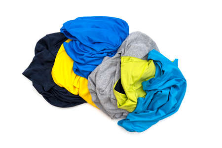 Heap of colored sport t-shirts isolated on white, top viewの写真素材
