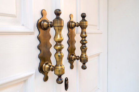 Elegance long door handle on wooden white doorの写真素材