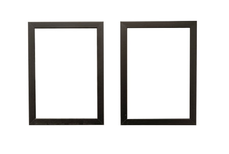 Two natural photo frames with blank space hanging on a wall, isolated on whiteの写真素材