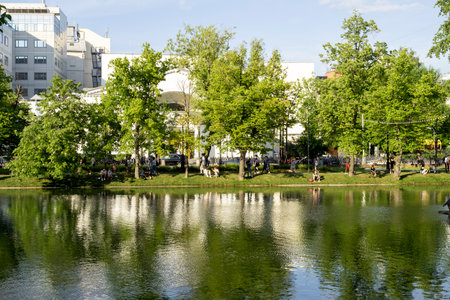 MOSCOW - JUN 07: People resting at the Clean ponds or Chistye Prudy pond during warm sunny day in Moscow, June 05. 2022 in Russiaのeditorial素材