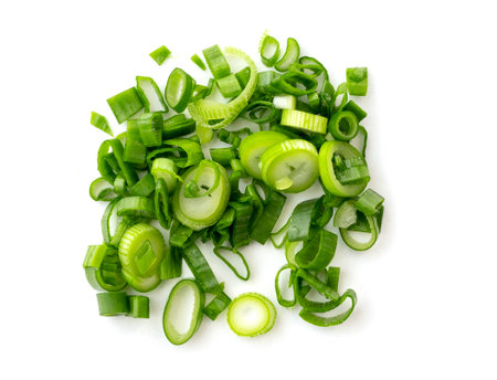 Chopped stems of green onion or chives isolated on white, top view.の写真素材
