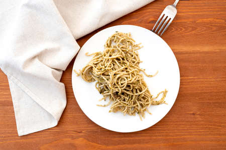 Old, cold not fresh pasta on ceramic plateの写真素材