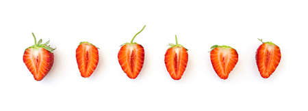 Long picture with row of slices natural strawberry isolated on whiteの写真素材