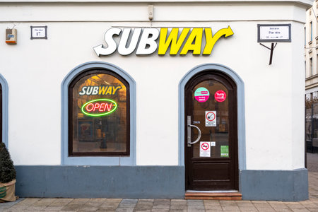 BUDAPEST - JAN 18: Entrance to the Subway cafe with signboard in Budapest, January 18. 2022 in Hungary. Subway is an American fast food restaurant franchise that sells submarine sandwichesのeditorial素材