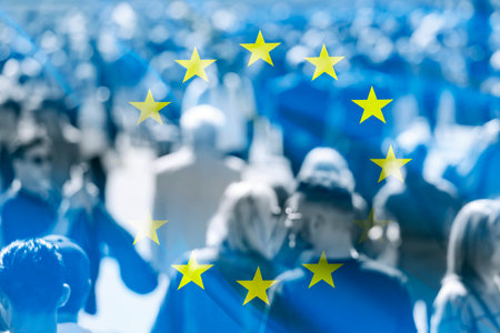 Crowd of people at the city and flag of EU, concept political pictureの写真素材