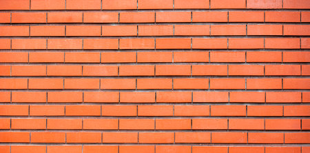 Brick wall of fence as texture or background, long picture of new modern brickworkの写真素材