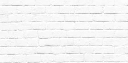Long picture with white round stone bricks, old vintage brick wall as texture or backgroundの写真素材