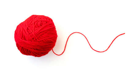 Ball with red yarn and thin rope isolated on whiteの写真素材