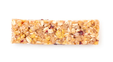 Sweet muesli bar with honey, berry and nuts isolated on white, top viewの写真素材