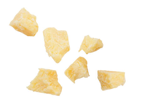 Pieces of fresh natural parmesan cheese isolated on whiteの写真素材