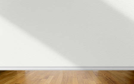 Empty room with white wall with abstract shadows on surface and wooden parquet floor as business mockupの写真素材