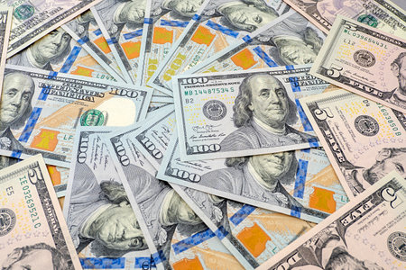 Top view of the new modern one hundred dollars and 5 dollar as backgroundの写真素材