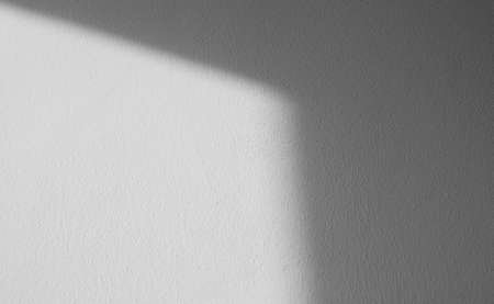 Abstract pattern of shadows by sunny beams on a wall as texture or backgroundの写真素材