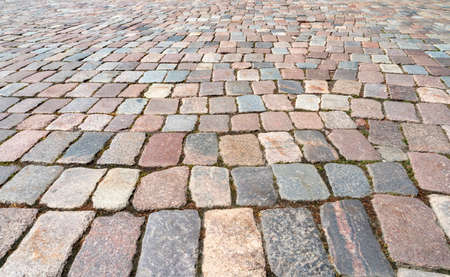 Natural old cobblestone sidewalk or pavement, top view, as texture or backgroundの写真素材