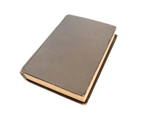 Closed brown vintage book with hard cardboard cover isolated on whiteの写真素材