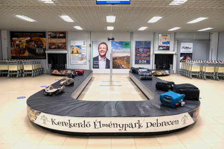 DEBRECEN - JAN 15: Transport tape or luggage conveyor belt with baggage in Debrecen international airport on January 15. 2022 in Hungaryのeditorial素材