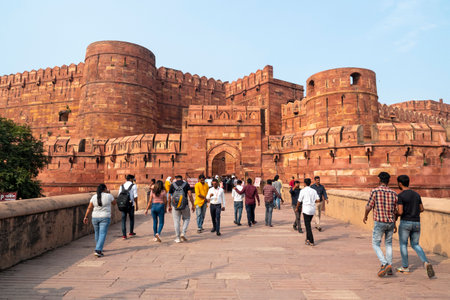 AGRA - SEP 24: The main view of Agra fort with red walls, gate and towers. Tourist at the Red fort in Agra on September 24. 2022 in Indiaのeditorial素材