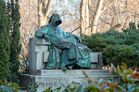 BUDAPEST - JANUARY 19: Statue of Anonymus in the City Park of Budapest on January 19. 2022 in Hungary. This monument was Created by Miklos Ligeti in 1903.のeditorial素材