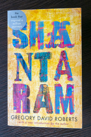BERLIN - NOVEMBER 18: Cover of famous Shantaram book by Gregory David Roberts on a table in Berlin, on November 18. 2022 in Germany.のeditorial素材