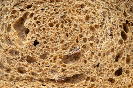 Close-up of crumb of bread, macro detail of bread surface as texture or backgroundの写真素材
