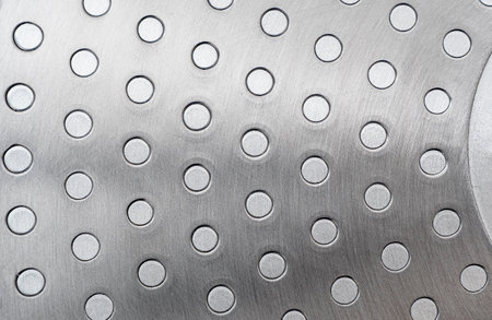 Close-up of silver iron bottom of pan or frying pan. Steel as texture or backgroundの写真素材