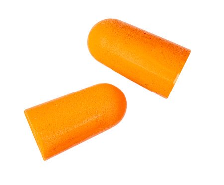 Orange earplugs isolated on white, top viewの写真素材