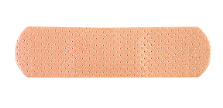 Typical adhesive bandage or sticking plaster isolated on white, front viewの写真素材