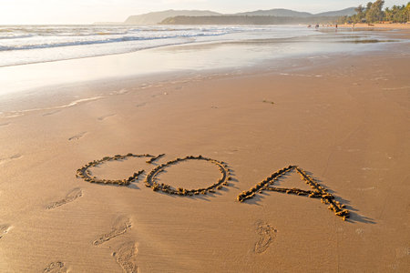 GOA word on sandy surface, summer beach with ocean shoreの写真素材