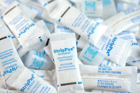 BERLIN - MARCH 31: Pile of moisture absorbing packets StripPax on a desk in Berlin on March 31. 2023 in Germanyのeditorial素材