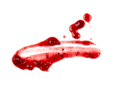 Sweet red berry jam, sauce as abstract smear stain isolated on white background, top viewの写真素材