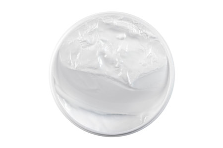 Jar, container with white universal cosmetic cream for face, body with blank clean surface isolated on white, top viewの写真素材
