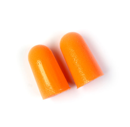 Orange earplugs isolated on white, top viewの写真素材