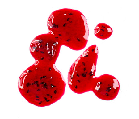 Drops and stains of liquid red berry jam or sauce isolated on transparent background, top viewの写真素材