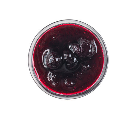Glass small bowl with sweet Black currant jam or sauce isolated on white, top viewの写真素材