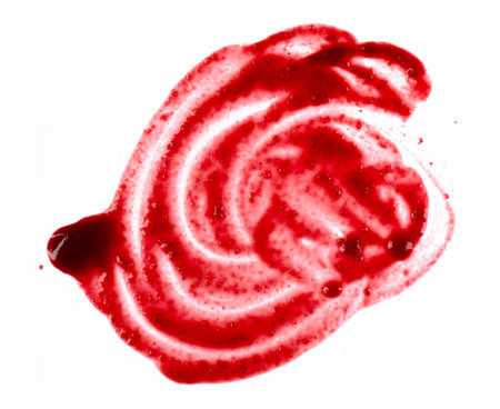 Red berry jam, sauce abstract smear, stain, drops isolated on white, top viewの写真素材