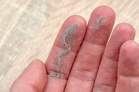 Close-up of palm with dust on fingersの写真素材