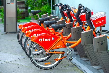 VILNIUS - JUL 07: Row of bicycles with RIMI logotype in Vilnius on July 07. 2022 in Lithuania. Rimi Baltic is a major retail operator in the Baltic states based in Riga, Latvia.のeditorial素材