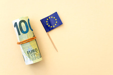EURO currency with 100 euro note and flag of European union, concept political pictureの写真素材