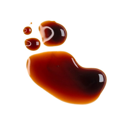 Smear, drops of brown soy sauce isolated on white, top viewの写真素材