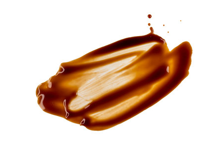 Abstract smear and stains of brown sauce isolated on whiteの写真素材