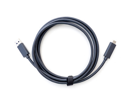 Twisted cable with standard USB and USB-C Type-C plugs isolated on whiteの写真素材